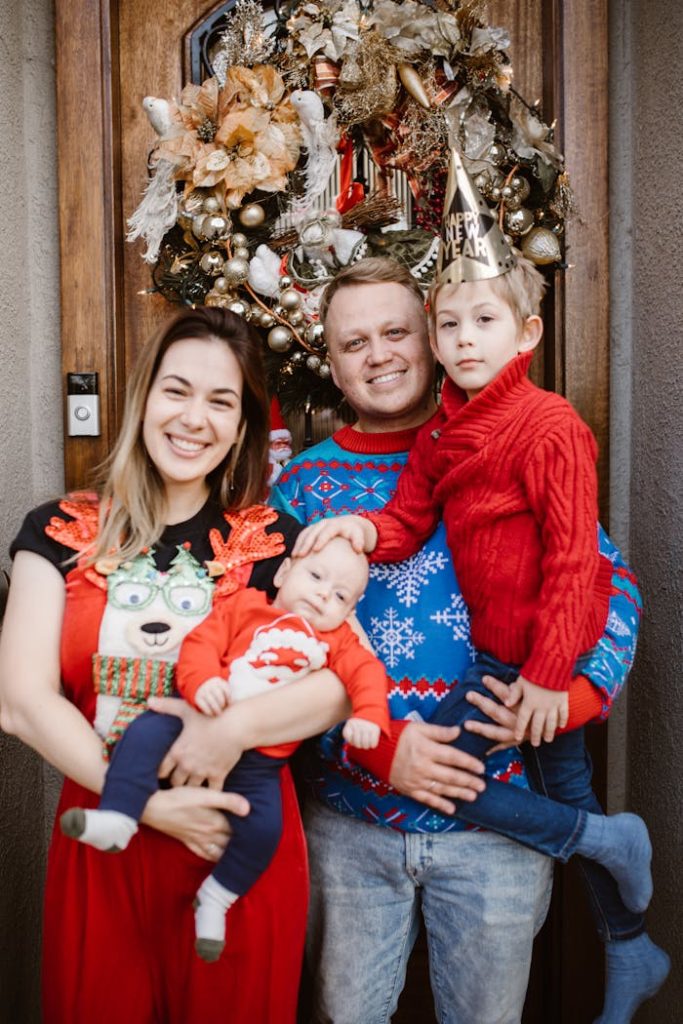 Joyful family portrait celebrating New Years Eve with decorations and smiles.